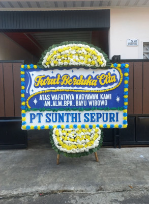 Papan Bunga Duka di Ujung Baru