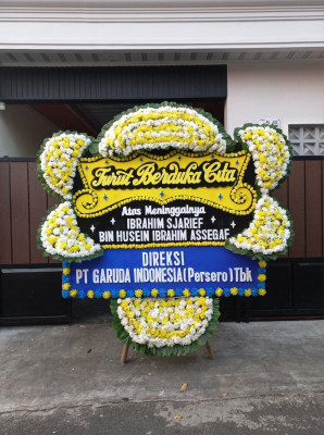 Papan Bunga Duka di Ujung Baru